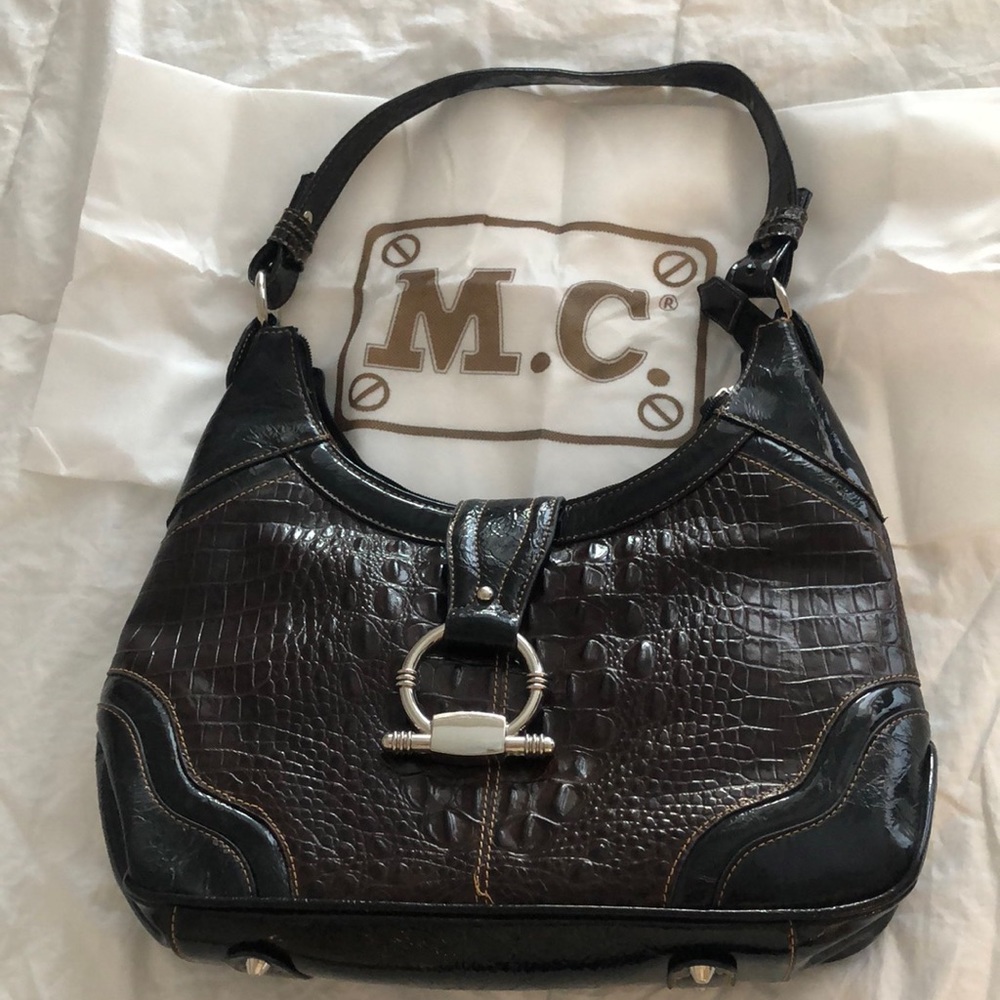 Rich and beautiful brown purse with silver decor!